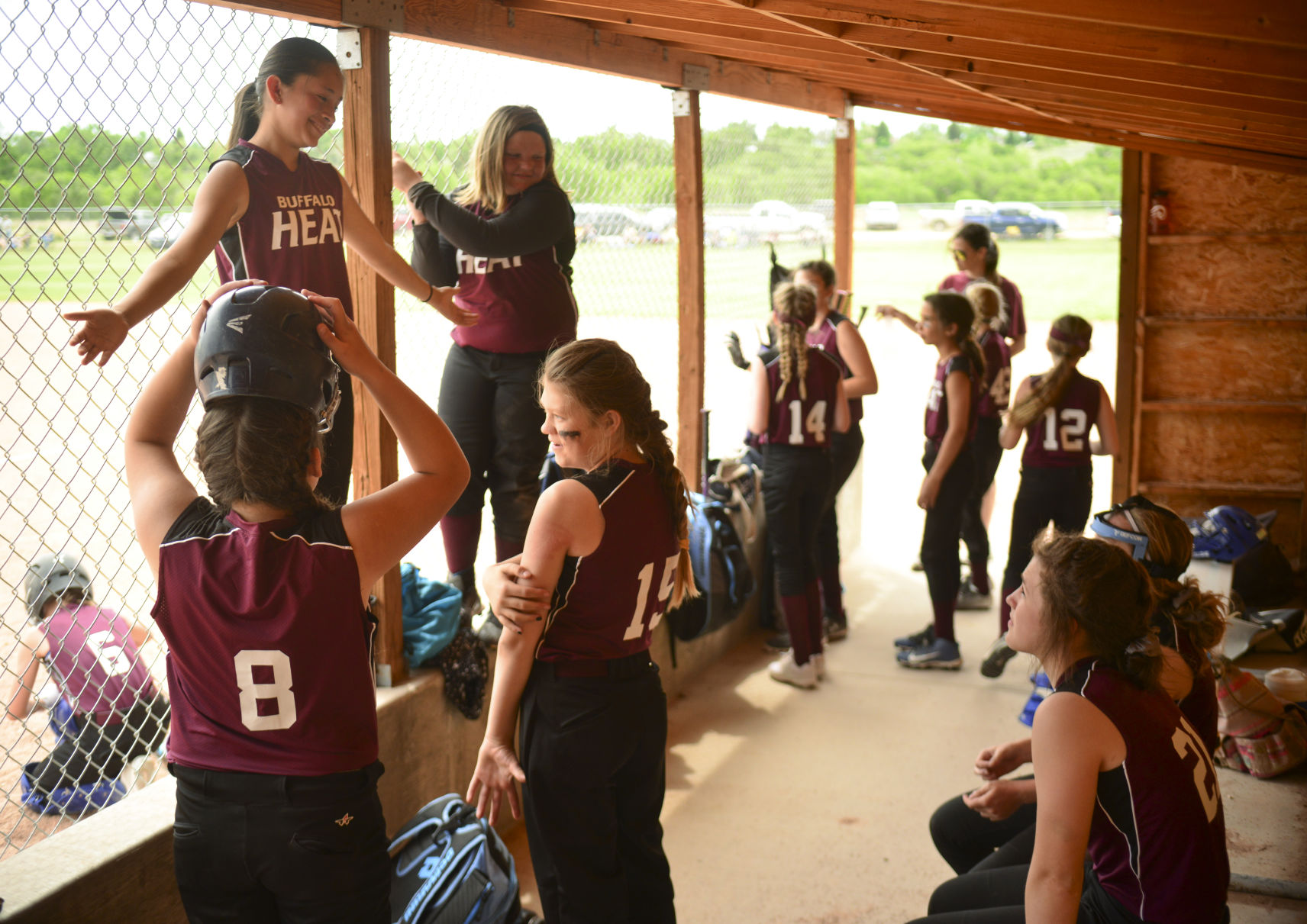 Gabby Hall, top left, asks her teammate if why she slid